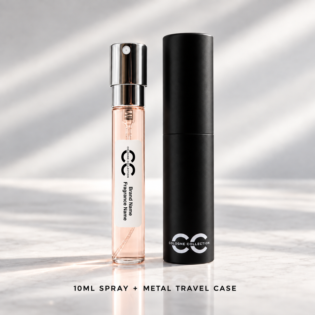 A 10ml perfume spray bottle filled with pink liquid stands next to its tall black metal travel case on a light marble surface with soft diagonal shadows. The bottle has a silver spray top and a white label with black text, and the case is branded &